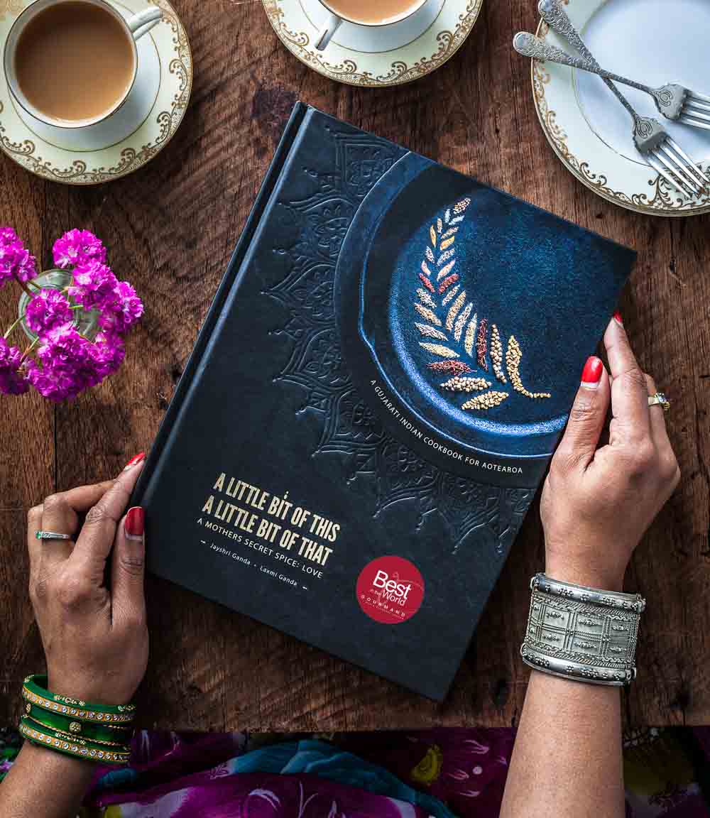 A little bit of this, a little bit of that Gujarati Indian Cookbook from New Zealand. A mother's secret spice; love.  By Laxmi and Jayshri Ganda - Mother Daughter duo - Front cover design, with gourmand award winning award