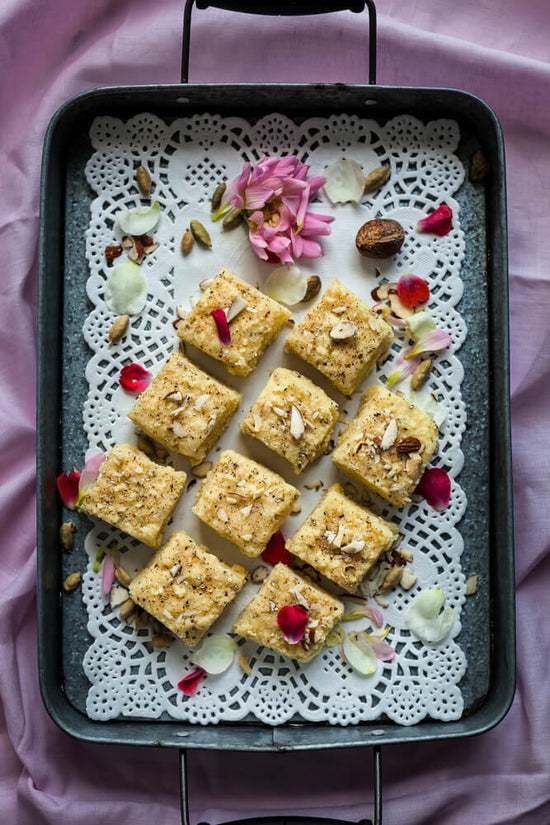 Barfi, Indian sweet on a tray with rose petals
