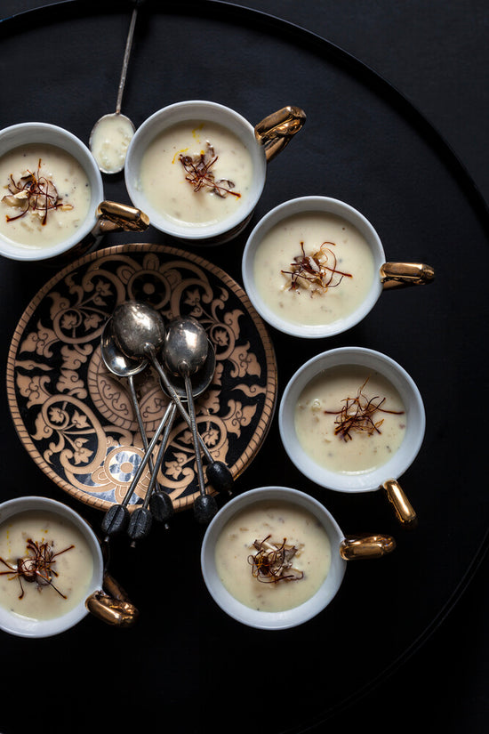 Dhoopark in 6 mini decorative teacups with teaspoons, topped with saffron 