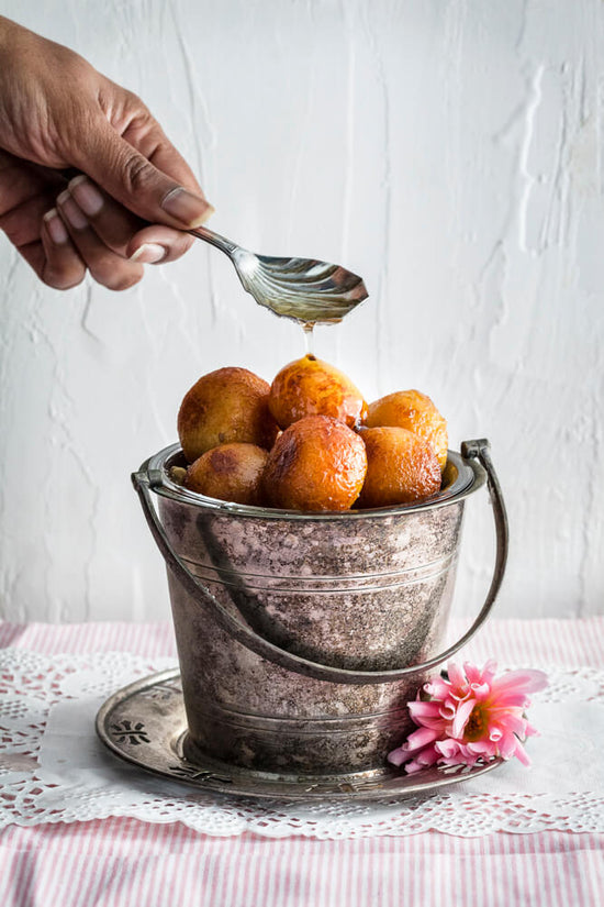 Gulab Jaman, a Indian donut ball made of milk powder and semolina and soaked in sugar syrup