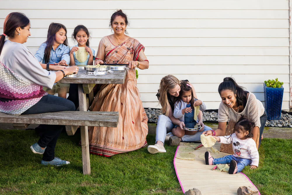 Laxmi Ganda teaches daughters, daughter-in-law and granddaughters how to make Gujarati Kechiya in the backyard on a hot summer's day