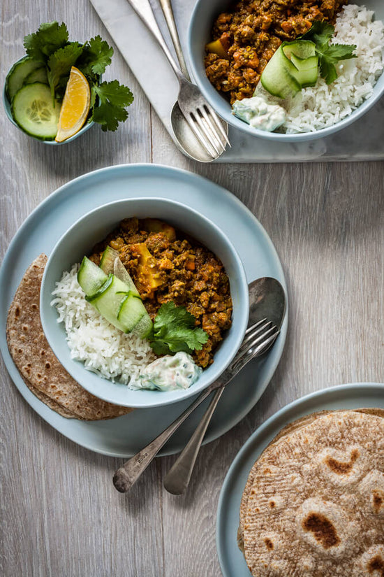Gujarati Kheemo and chorka, mince curry and rice with raita, and Gujarati rotli