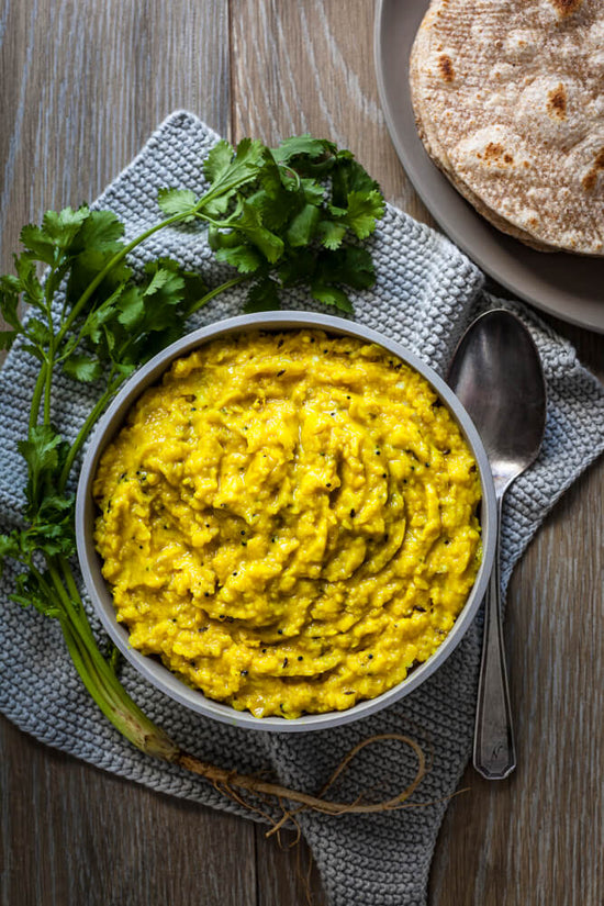 moong ne dahl, mung dhal, Yellow split moong dahl in a bowl with coriander