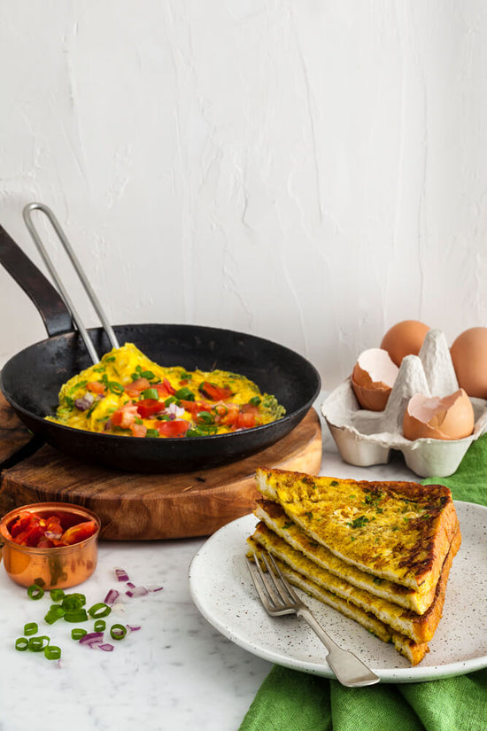 Masala Omelette and Masala French Toast with fresh red chilli, broken egg shells, diced tomatoes and spring onions