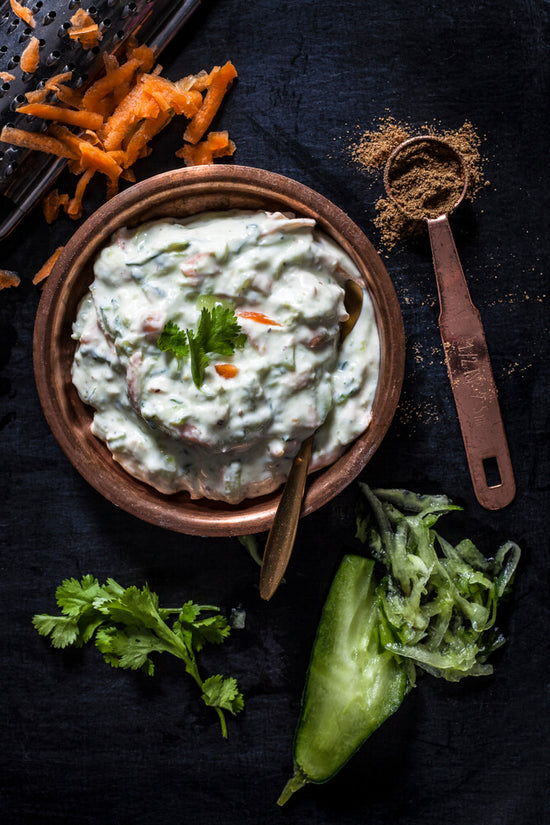 Raita, a Gujarati Indian Yoghurt dish with cumin, grated cucumber and carrot