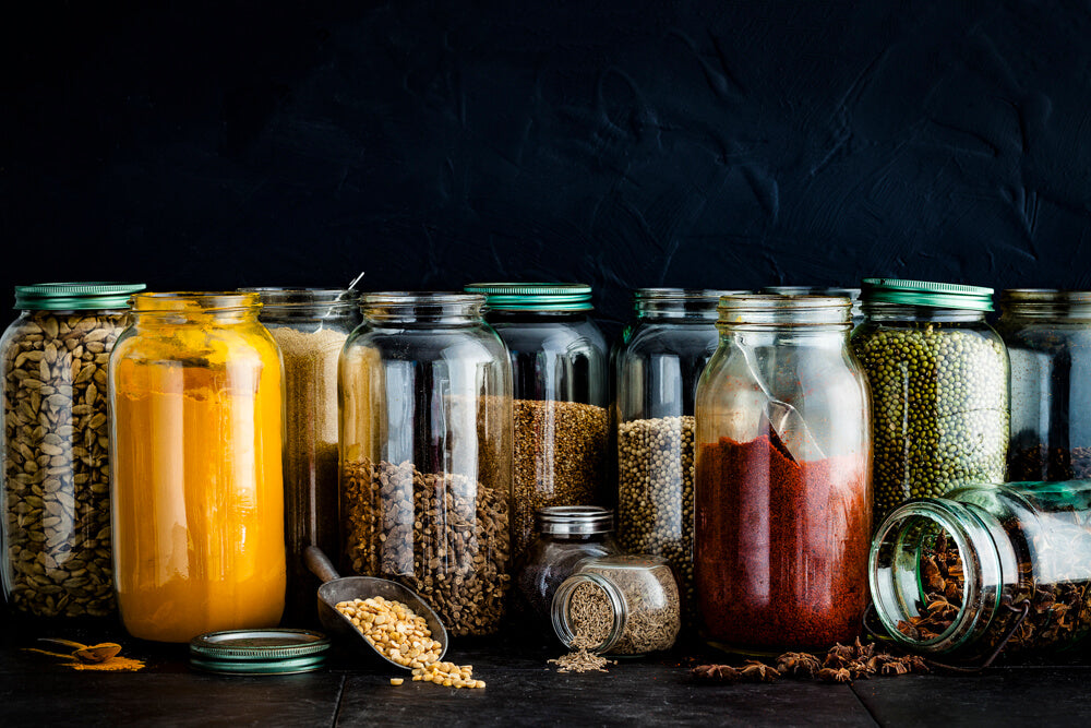 Indian Pantry with large glass jars full of Indian spices